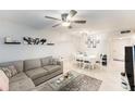 Cozy living and dining area with comfortable seating, modern decor, and bright natural light at 9700 Starkey Rd # 312, Seminole, FL 33777