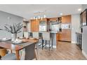 Gourmet kitchen with granite countertops, stainless steel appliances, an island, and a dining table at 1120 E Kennedy Blvd # 1512, Tampa, FL 33602