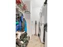 Small laundry room featuring a stacked washer and dryer, as well as closet storage for clothes and shoes at 1120 E Kennedy Blvd # 1512, Tampa, FL 33602