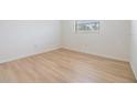 Bright bedroom features new flooring, clean, neutral walls and base trim at 1485 Lakeview Rd # 19, Clearwater, FL 33756