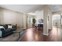 Spacious living room with hardwood floors, neutral walls, and bright windows offers a welcoming atmosphere at 1933 Fruitridge St, Brandon, FL 33510