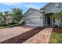 Lovely single-Gathering home with a brick driveway and well-maintained landscaping at 212 Shell Creek Ct, Apollo Beach, FL 33572