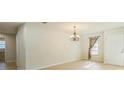 Inviting living room featuring light wood floors, natural light, and chandelier at 2204 78Th W St, Bradenton, FL 34209