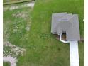 Birds eye view of a gray home with a gray roof and an extended driveway on an oversized lot at 2330 Hiers Rd, Dover, FL 33527