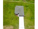 Aerial view of property showcasing the house, expansive lawn, and surrounding landscape at 2414 Hiers Rd, Dover, FL 33527