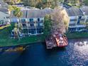 Aerial view of waterfront townhomes with private docks overlooking the serene lake at 2648 Sabal Springs Dr # 2, Clearwater, FL 33761