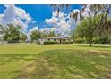 Expansive backyard perfect for outdoor activities, partially fenced, and ample space at 3217 Mott Rd, Dover, FL 33527