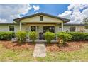 Inviting front porch with seating and charming details, enhances curb appeal at 3217 Mott Rd, Dover, FL 33527