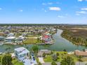 Waterfront community aerial view featuring homes along canals with scenic views of the surrounding landscape at 3226 Gardenia Dr, Hernando Beach, FL 34607