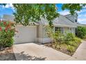 View of the driveway and two-car garage, showcasing the home's exterior features at 3865 Gatewood Dr, Sarasota, FL 34232