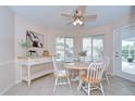 Cozy dining area with bright natural light, a ceiling fan, and seamless access to outdoor pool at 4368 Las Palmas Ave, Spring Hill, FL 34606