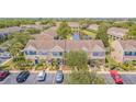 Townhome community featuring manicured lawns and lakeside views at 6229 Bayside Key Dr, Tampa, FL 33615