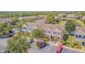 View of a charming townhome community with a picturesque pond at 6229 Bayside Key Dr, Tampa, FL 33615