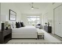 Serene main bedroom featuring natural light, a large window, and ample closet space for comfortable living at 6229 Bayside Key Dr, Tampa, FL 33615