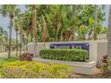 Bayside Key entrance sign surrounded by lush tropical plants and greenery at 6229 Bayside Key Dr, Tampa, FL 33615