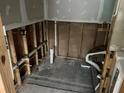 Bathroom space under renovation with exposed pipes and framework at 7333 Royal Palm Dr # 34652, New Port Richey, FL 34652