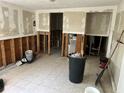 Spacious room undergoing renovations, with exposed framing and tile flooring at 7333 Royal Palm Dr # 34652, New Port Richey, FL 34652