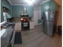 Well-equipped kitchen with modern appliances and ample counter space for meal preparation at 10142 118Th Ave, Largo, FL 33773