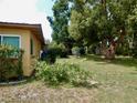 This sprawling green backyard is perfect for entertaining with privacy landscaping, and a storage shed at 10308 Fore Dr, Tampa, FL 33612