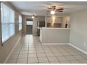 Bright kitchen with tiled floor, stainless steel appliances, and ample natural light for a welcoming cooking space at 10367 109Th Ave, Largo, FL 33773