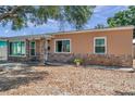 Single-story home with a combination of brick and stucco, complemented by a tidy front yard at 1117 Tyrone N Blvd, St Petersburg, FL 33710