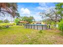 Spacious backyard features an above-ground pool and ample room for outdoor activities and entertainment at 14339 Mayer Ave, Hudson, FL 34669