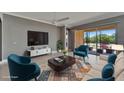 Bright living room with neutral walls and bright accents provides a cozy space for relaxation and entertaining at 1643 Emerald Dunes Dr, Sun City Center, FL 33573