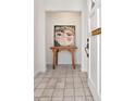 Inviting foyer with neutral tile flooring and stylish decor, creating a welcoming entrance to the home at 2120 S Hesperides St, Tampa, FL 33629