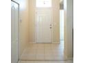 Tiled foyer with front door, interior door and closet at 2325 Brookfield Greens Cir # 41, Sun City Center, FL 33573