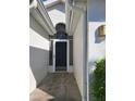Front door with arched window, screen door, and concrete walkway at 2325 Brookfield Greens Cir # 41, Sun City Center, FL 33573