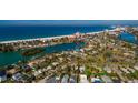 Quaint coastal home with a pool nestled in lush landscaping near the beach and local attractions at 3111 S De Bazan Ave, St Pete Beach, FL 33706