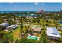 Beautiful home with a pool and expansive yard in a vibrant coastal community, offering luxurious living at 3111 S De Bazan Ave, St Pete Beach, FL 33706