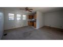An open floorplan showing the living room connected to the kitchen with natural light at 3258 Adrian Ave, Largo, FL 33774