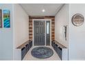 Welcoming entryway featuring built-in seating, stylish accents, and neutral decor at 3968 Orchard Hill Cir, Palm Harbor, FL 34684