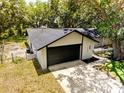 Aerial view of the home showing the architectural lines and backyard at 4260 Saint Lawrence Dr, New Port Richey, FL 34655