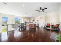 Open concept living and kitchen area with hardwood floors and stainless steel appliances at 4353 Dewey Dr, New Port Richey, FL 34652