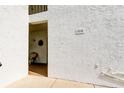 Exterior view of the condo entrance with a covered porch area at 700 Starkey Rd # 1216, Largo, FL 33771