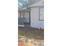 Charming covered front porch with gray railing, perfect for relaxing outdoors at 9307 N 16Th St, Tampa, FL 33612