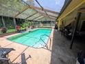 Screened-in pool and patio area for outdoor relaxation and enjoyment of the Florida sunshine at 7535 Cypress Knoll Dr, New Port Richey, FL 34653