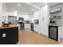 Modern kitchen features white cabinets, stainless steel appliances, and a butcher block island at 3300 52Nd N St, St Petersburg, FL 33710
