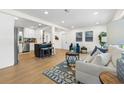 Bright and airy living room with an open floor plan, hardwood floors, and contemporary furnishings at 3300 52Nd N St, St Petersburg, FL 33710