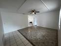 Bright living room featuring tile flooring, a ceiling fan, and neutral paint tones at 103 Inwood Cir, Brandon, FL 33510