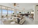 Inviting living area with plush sofa and large windows offering panoramic ocean views at 17900 Gulf Blvd # 16C, Redington Shores, FL 33708