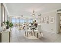 Bright and airy living room with floor-to-ceiling windows and access to a balcony at 17900 Gulf Blvd # 16C, Redington Shores, FL 33708