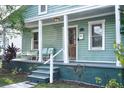 Quaint single-story home with a covered porch and lovely curb appeal at 2320 E 12Th Ave, Tampa, FL 33605