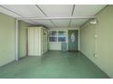 Spacious carport featuring a convenient storage shed and direct access to the front entrance at 250 Rosery Nw Rd # 218, Largo, FL 33770