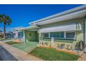 Inviting single-story home with a covered carport and a delightful garden bed at 250 Rosery Nw Rd # 218, Largo, FL 33770