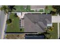 Aerial view of property with fenced backyard, screened-in patio, and well-maintained landscaping at 3201 Pine Top Dr, Valrico, FL 33594