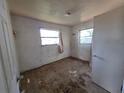Vacant bedroom features worn walls, flooring, and minimal natural light at 3720 12Th S Ave, St Petersburg, FL 33711