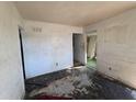 Vacant bedroom showcases worn walls, flooring, and natural light at 3720 12Th S Ave, St Petersburg, FL 33711